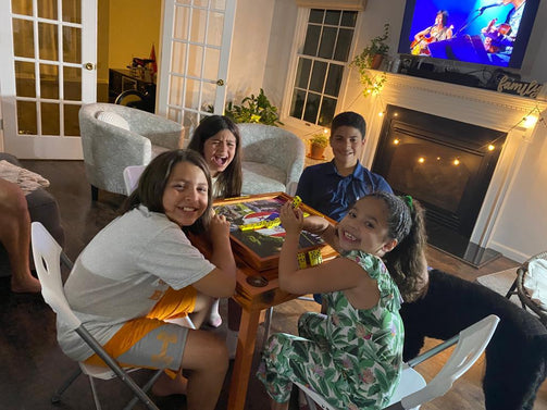 Puerto Rican Family Playing Dominoes on Custom Domino Table