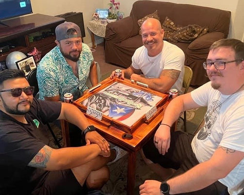 Friends playing Dominos on Puerto Rican Domino Table